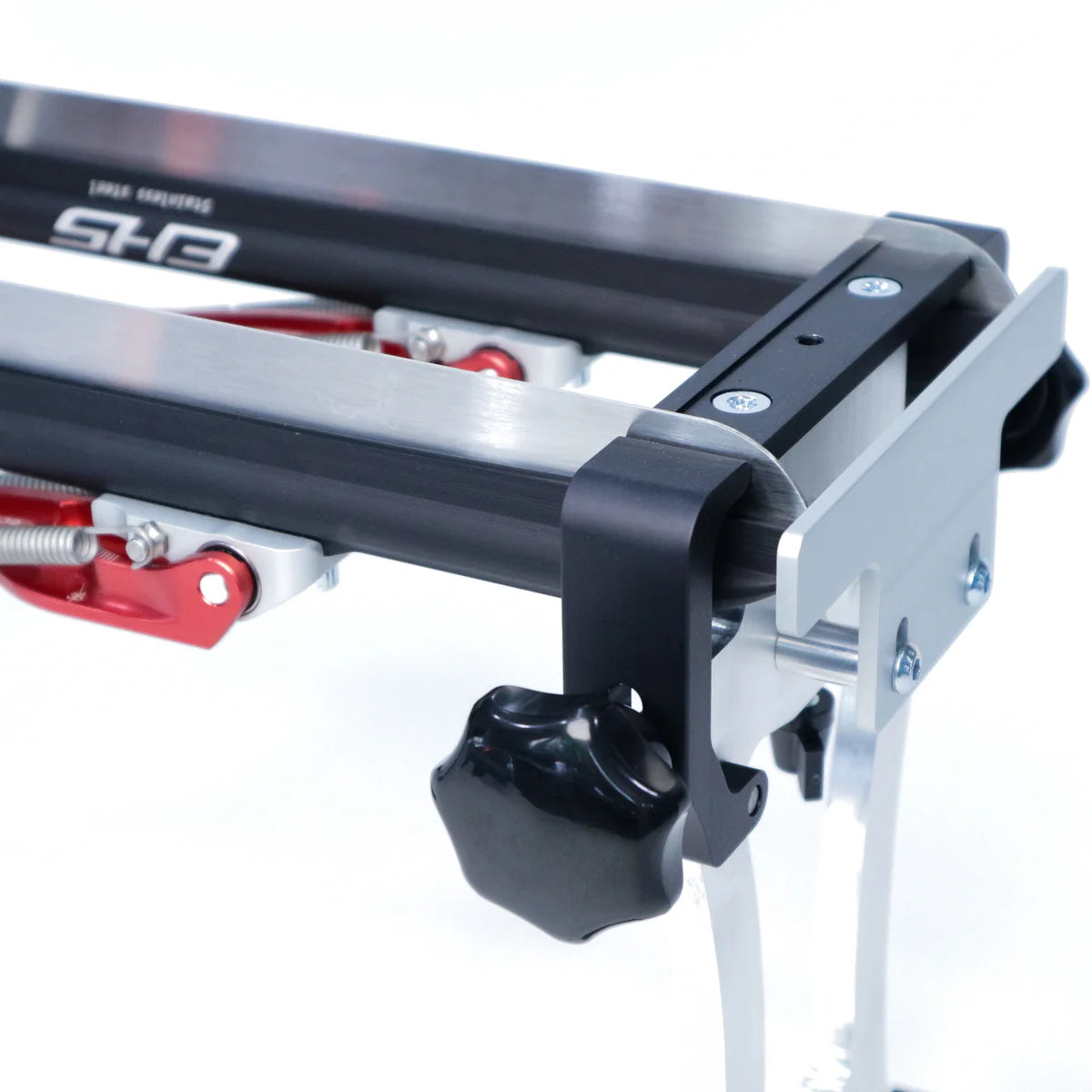 Metal EHS sharpening jig with black and silver components, red levers, and a black plastic adjustment knob.
